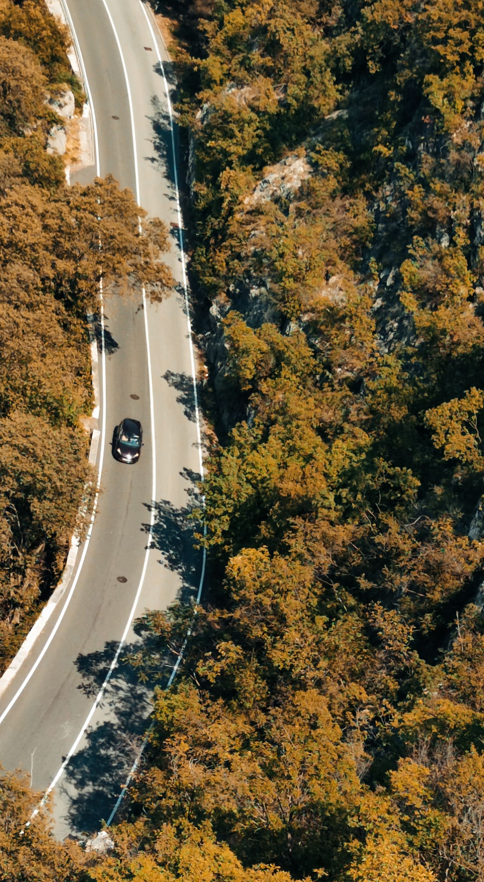 Car on a winding mountain road in Croatia